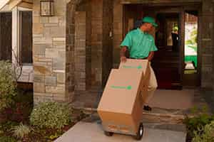 residential movers transporting belongings into home